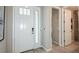 Welcoming entryway with a white front door and tile flooring at 5130 Slate Hue Pl, Apollo Beach, FL 33572