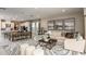 Spacious open-concept living area seamlessly connected to the kitchen and dining space at 5130 Slate Hue Pl, Apollo Beach, FL 33572