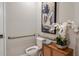 Small yet stylish powder room with a toilet, sink and decorative plants at 5130 Slate Hue Pl, Apollo Beach, FL 33572