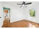 Bedroom with hardwood floors and view of another room at 525 Jasmine S Way, St Petersburg, FL 33705