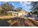 Charming home with attached two-car garage, gravel driveway, and fenced yard at 6301 Hobson Ne St, St Petersburg, FL 33702