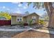 Charming green one-story home with a welcoming front yard and stepping stone pathway at 6301 Hobson Ne St, St Petersburg, FL 33702