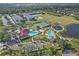Community amenities including a pool, playground, tennis court, clubhouse, and open green space at 6937 Exeter Park Pl, Apollo Beach, FL 33572