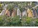 Aerial view of residential rooftops and trees in a suburban neighborhood at 6937 Exeter Park Pl, Apollo Beach, FL 33572