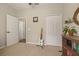 Bedroom or office space with closet, shelving unit and guitar at 6937 Exeter Park Pl, Apollo Beach, FL 33572