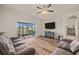 Inviting living room with sliding glass doors leading to a screened patio at 6937 Exeter Park Pl, Apollo Beach, FL 33572
