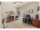 Home office or den with desk, chair, and shelving at 6937 Exeter Park Pl, Apollo Beach, FL 33572