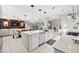 Modern kitchen with white cabinets, an island, and stainless steel appliances at 8750 Ivy Stark Blvd, Wesley Chapel, FL 33545