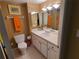Bright bathroom with white vanity and a large mirror at 880 Mandalay Ave # C314, Clearwater Beach, FL 33767