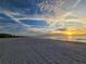 Serene beach scene at sunset with clear sky and ocean view at 880 Mandalay Ave # C314, Clearwater Beach, FL 33767