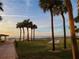 Relaxing beach view with palm trees and shuffleboard court at 880 Mandalay Ave # C314, Clearwater Beach, FL 33767