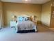 Spacious bedroom with striped bedding and ensuite access at 880 Mandalay Ave # C314, Clearwater Beach, FL 33767