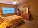 Bedroom with double bed, dresser, and window with blinds at 880 Mandalay Ave # C314, Clearwater Beach, FL 33767