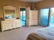 Main bedroom with balcony access and built-in storage at 880 Mandalay Ave # C314, Clearwater Beach, FL 33767