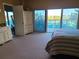 Main bedroom with large windows and ocean view at 880 Mandalay Ave # C314, Clearwater Beach, FL 33767