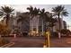 Elegant beachfront building exterior at dusk at 880 Mandalay Ave # C314, Clearwater Beach, FL 33767