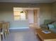 Kitchen with breakfast bar and view to living room at 880 Mandalay Ave # C314, Clearwater Beach, FL 33767