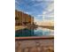 Inviting community pool with building reflection at 880 Mandalay Ave # C314, Clearwater Beach, FL 33767