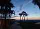 Lighted walkway to the beach at twilight, offering a serene ambiance at 880 Mandalay Ave # C314, Clearwater Beach, FL 33767