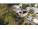 Aerial view showcasing the house, pool, and solar panels at 9703 33Rd E Ave, Palmetto, FL 34221