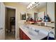 Double vanity bathroom with a toilet and shower at 9703 33Rd E Ave, Palmetto, FL 34221