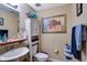 Clean and bright bathroom with a pedestal sink and updated vanity at 9703 33Rd E Ave, Palmetto, FL 34221