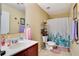 Clean bathroom with a shower/tub combo, toilet, and vanity at 9703 33Rd E Ave, Palmetto, FL 34221