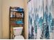 Small bathroom with shower and linen storage at 9703 33Rd E Ave, Palmetto, FL 34221