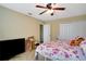 Bedroom with floral bedding and a flat-screen TV at 9703 33Rd E Ave, Palmetto, FL 34221