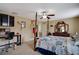 Comfortable bedroom with a four-poster bed, home office space, and bathroom access at 9703 33Rd E Ave, Palmetto, FL 34221
