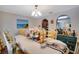 Formal dining room with ornate chairs and a view to the kitchen at 9703 33Rd E Ave, Palmetto, FL 34221