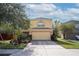 Two-story house with a two-car garage and lush landscaping at 9703 33Rd E Ave, Palmetto, FL 34221