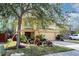 Two-story house with a large tree and manicured lawn at 9703 33Rd E Ave, Palmetto, FL 34221