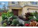 Inviting front entrance with colorful flowers and plants at 9703 33Rd E Ave, Palmetto, FL 34221