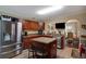 Spacious kitchen with an island, stainless steel appliances, and wood cabinets at 9703 33Rd E Ave, Palmetto, FL 34221