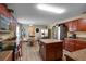 Eat-in kitchen with island, stainless steel appliances, and wood cabinets at 9703 33Rd E Ave, Palmetto, FL 34221