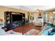 Living Room with hardwood floors and large TV at 9703 33Rd E Ave, Palmetto, FL 34221