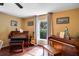 Inviting music room featuring piano, organ, guitar, and ample natural light at 9703 33Rd E Ave, Palmetto, FL 34221