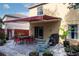 Backyard patio with seating, a grill, and a retractable awning at 9703 33Rd E Ave, Palmetto, FL 34221