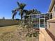 Spacious backyard with a screened-in pool area, offering privacy and outdoor enjoyment at 10101 Paddock Oaks Dr, Riverview, FL 33569
