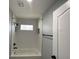 Bathroom showcasing white subway tiles in shower and neutral decor with modern fixtures and hardware at 10101 Paddock Oaks Dr, Riverview, FL 33569