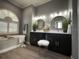 Relaxing bathroom with soaking tub, dual sinks, and contemporary design at 10101 Paddock Oaks Dr, Riverview, FL 33569