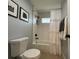 Updated bathroom featuring tiled shower and neutral decor with modern fixtures and hardware at 10101 Paddock Oaks Dr, Riverview, FL 33569