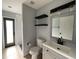 Modern bathroom featuring gray walls, a sleek vanity, and a glass-enclosed shower for a spa-like experience at 10101 Paddock Oaks Dr, Riverview, FL 33569