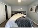 Relaxing bedroom with gray walls, stylish decor, and a sliding closet door for storage at 10101 Paddock Oaks Dr, Riverview, FL 33569