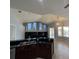 Open kitchen with dark countertops, stainless steel appliances and a view of the living space at 10101 Paddock Oaks Dr, Riverview, FL 33569