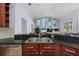 Kitchen featuring a large stainless steel sink and granite countertops with a view into the living room at 10101 Paddock Oaks Dr, Riverview, FL 33569