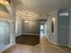 Spacious living room with tray ceiling and modern light fixture at 10101 Paddock Oaks Dr, Riverview, FL 33569