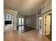 Bright living room with seamless flow to the outdoors through French doors, blending indoor/outdoor living at 10101 Paddock Oaks Dr, Riverview, FL 33569