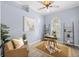 Cozy home office featuring natural light, neutral paint, modern decor, and comfortable seating at 10101 Paddock Oaks Dr, Riverview, FL 33569